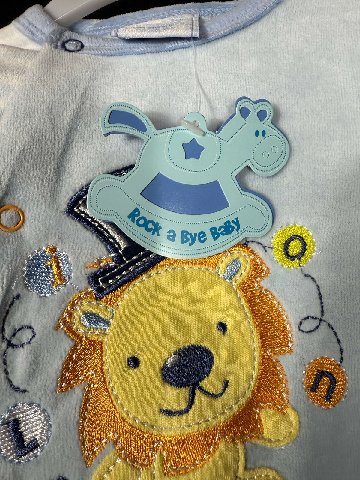 🦁 Baby Big Top Lion Sleepsuit – Blue or Yellow